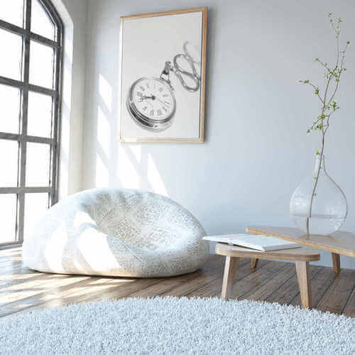 Tappeto rotondo di colore bianco.