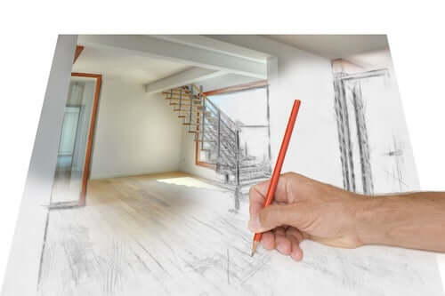 Uomo che disegna il progetto della casa.